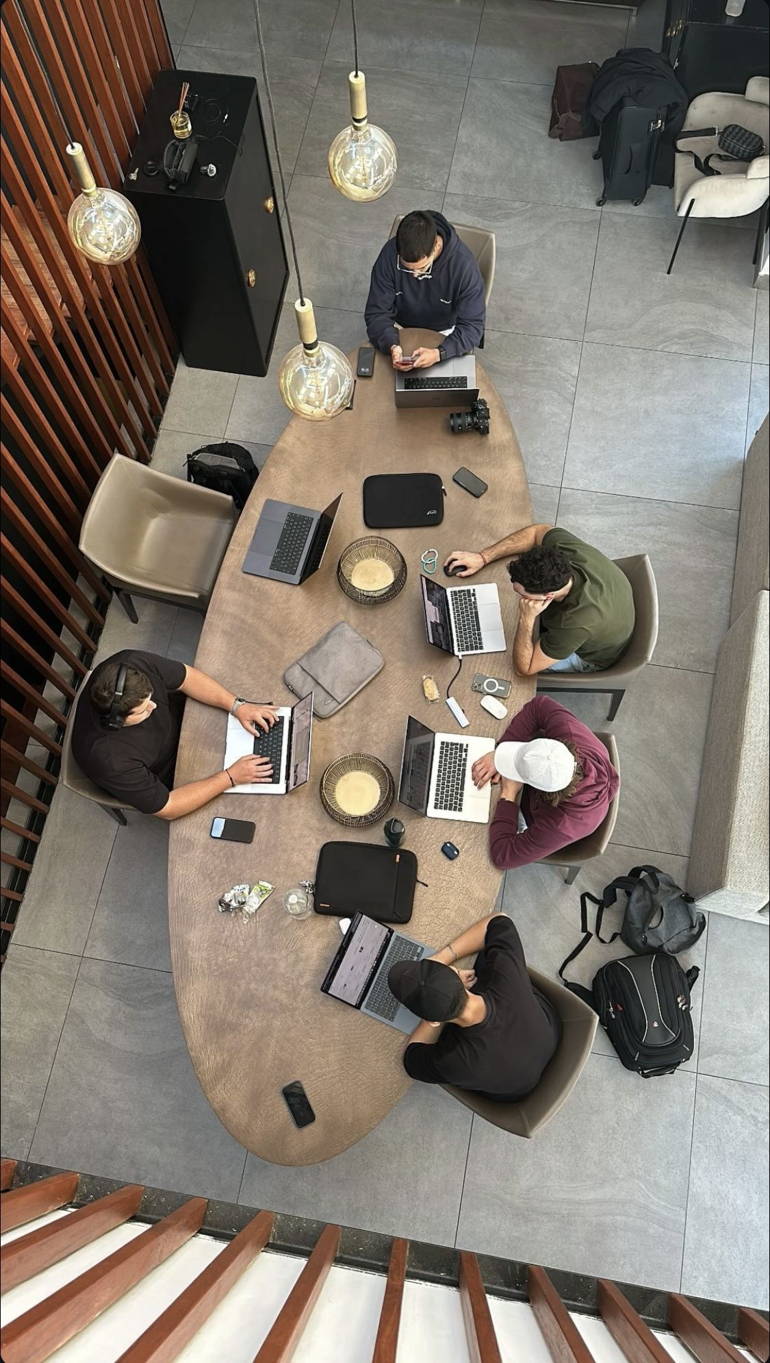 Overhead view of a team working around a table