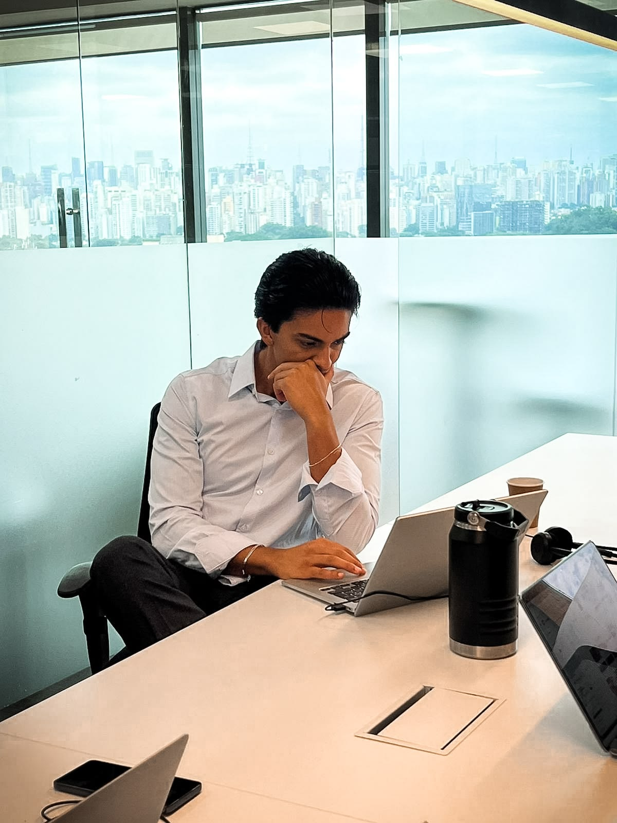 A colleague working on a laptop